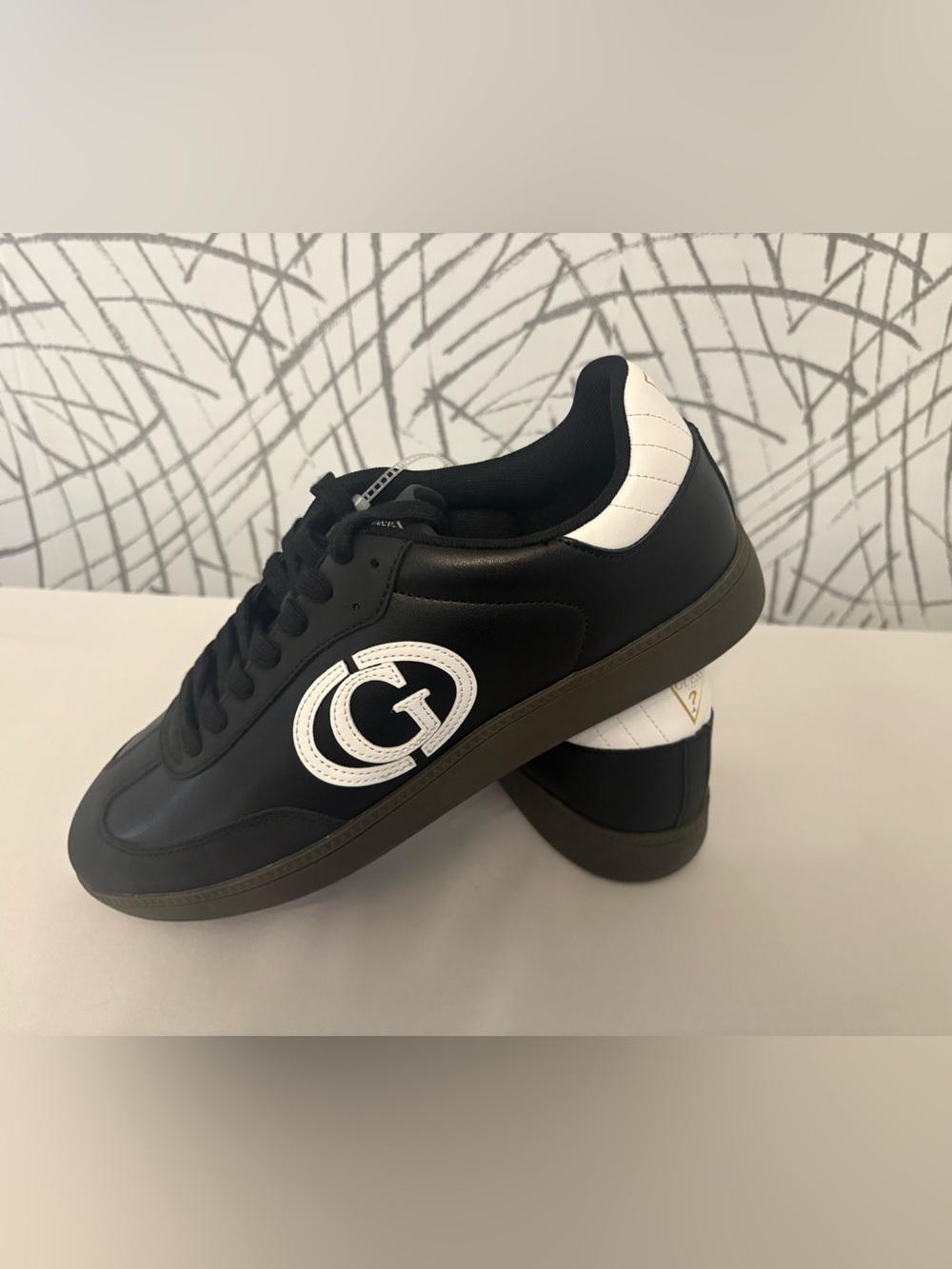 Guess Men's Borge sneakers in black featuring a large "G" logo.